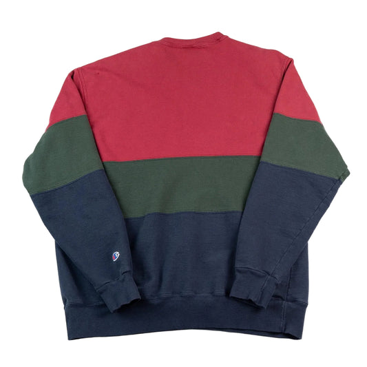 Color-blocked sweatshirt with red, green, and navy sections on a white background