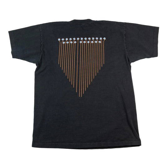 Black t-shirt with a unique design on the back against a white background