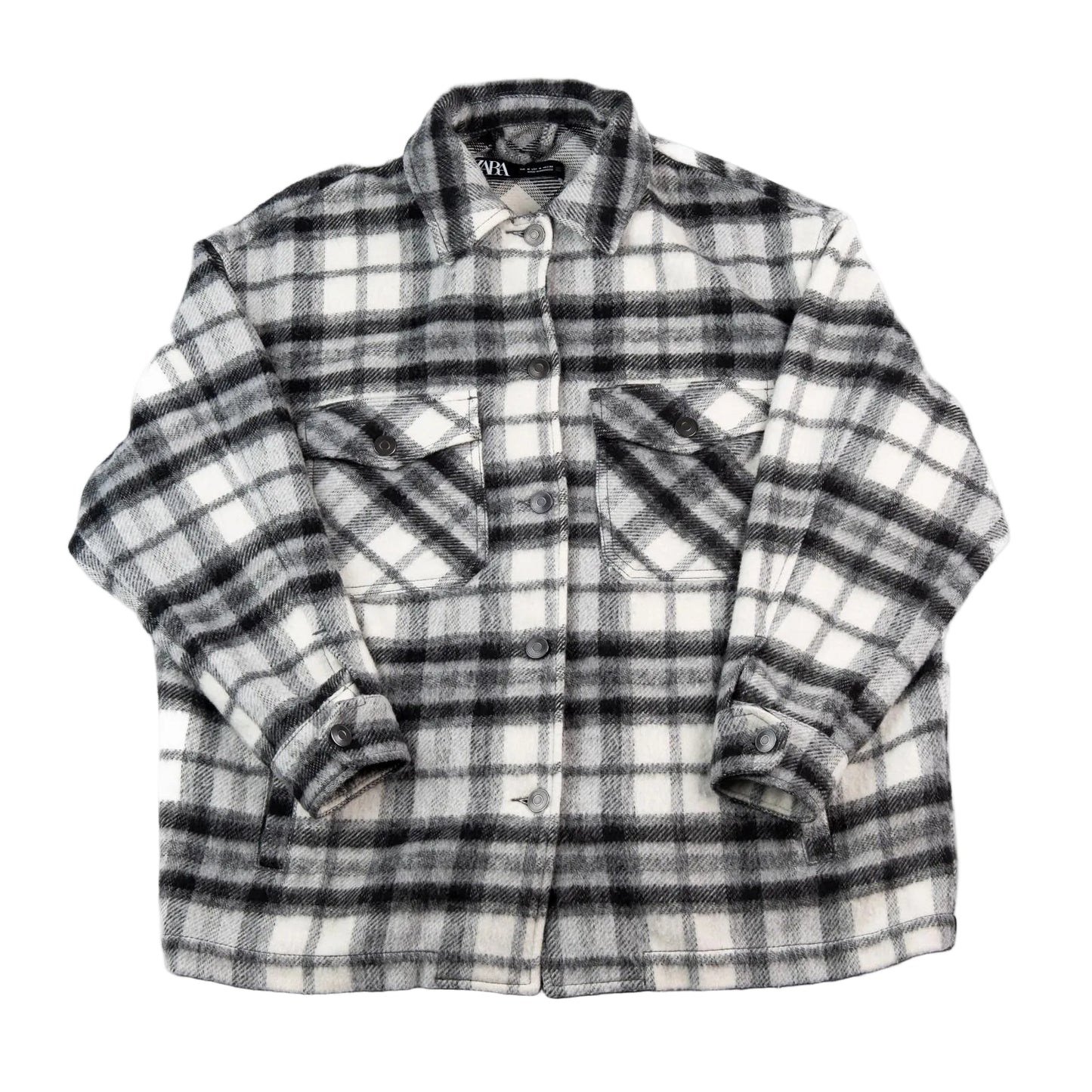 Plaid shirt with rolled-up sleeves on a white background
