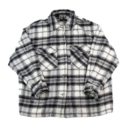 Plaid shirt with rolled-up sleeves on a white background