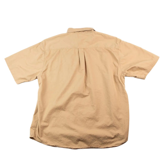 Beige short-sleeve shirt on a white background