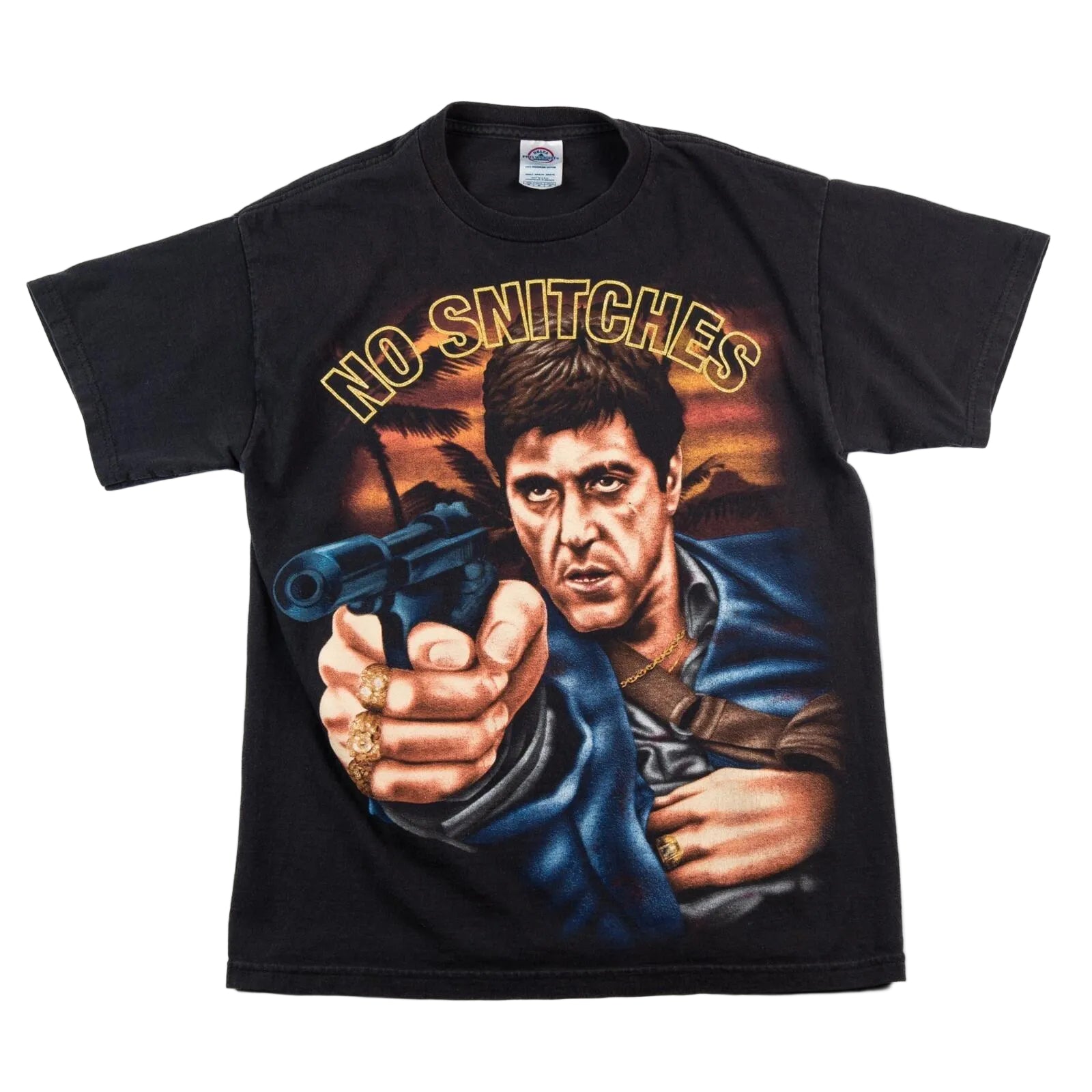 Black t-shirt with graphic of a man holding a gun and 'No Snitches' text on a white background