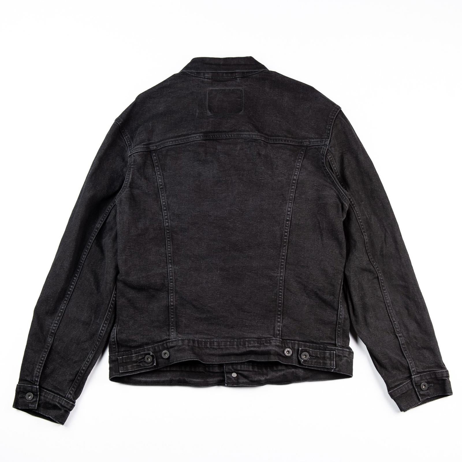 Black denim jacket on a white background