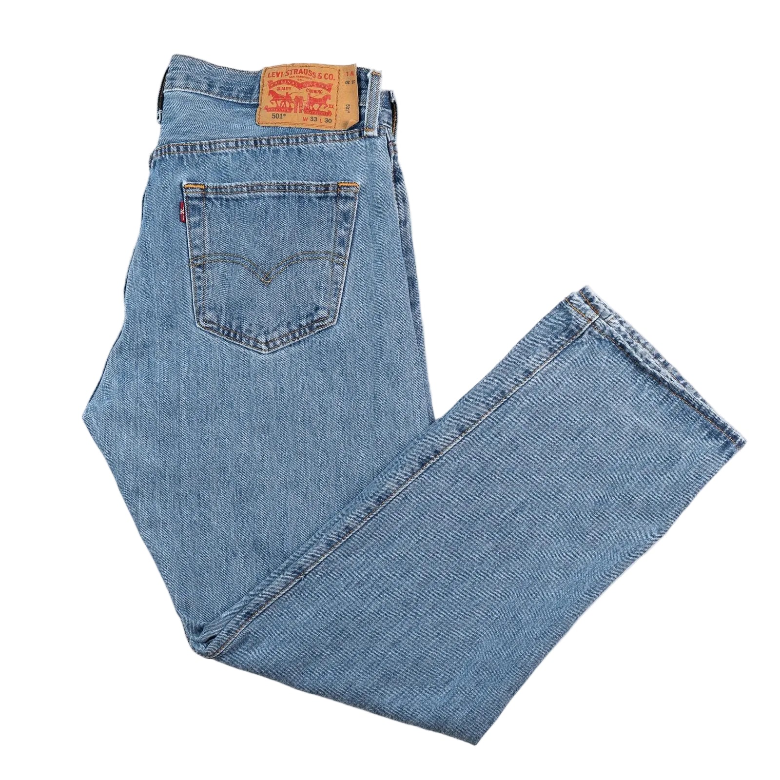 Folded pair of blue jeans with Levi's logo on a white background