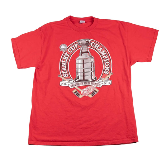 Red t-shirt with Stanley Cup Champions logo on a white background
