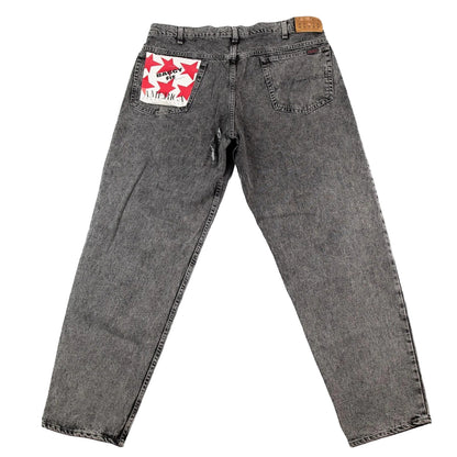 Gray jeans with a brand logo on the pocket against a white background