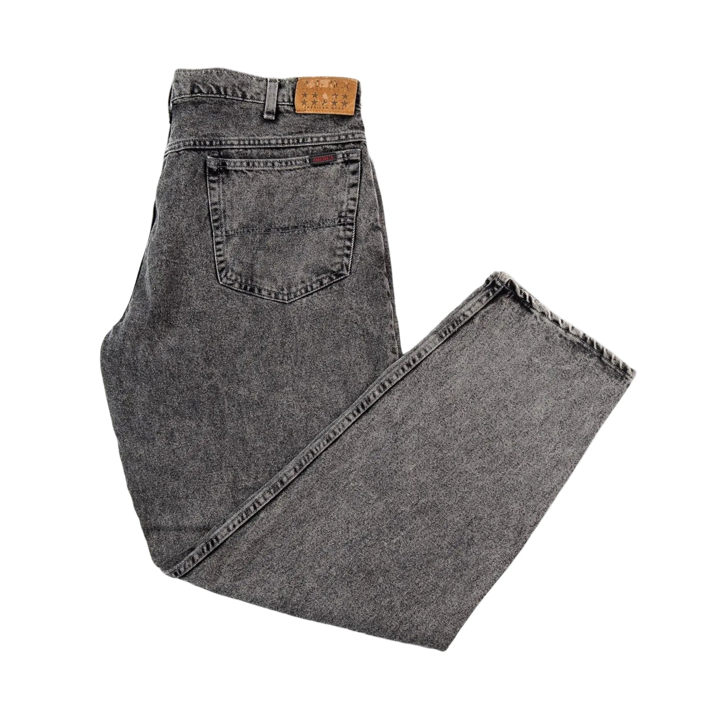 Folded pair of gray jeans on a white background