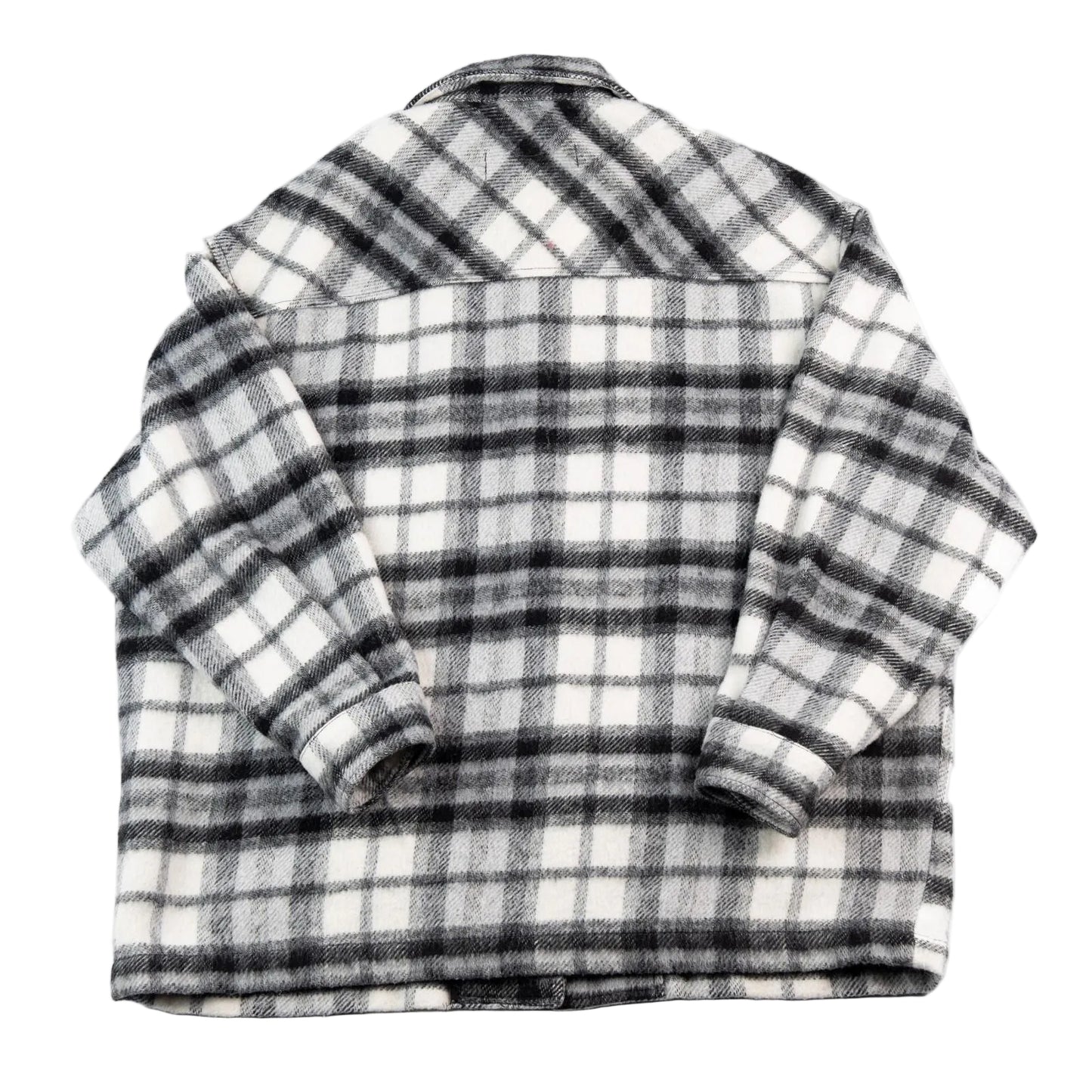 Folded black and white plaid shirt on a white background