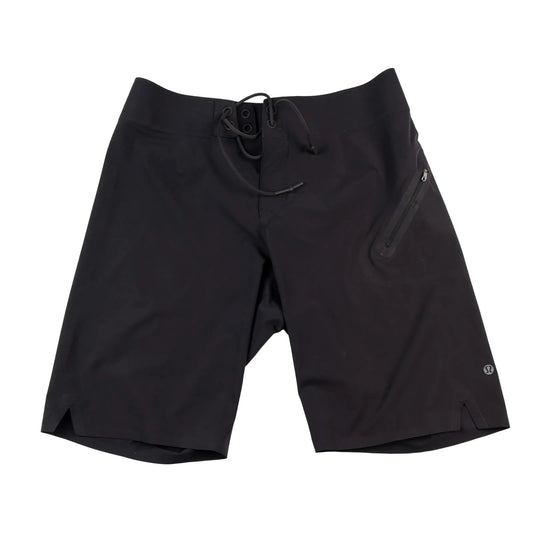 Black shorts with a drawstring on a white background