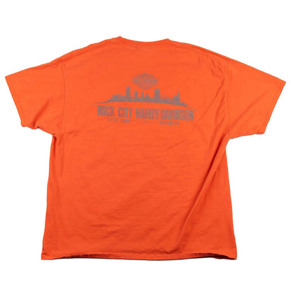 Orange t-shirt with a graphic design on the back on a white background