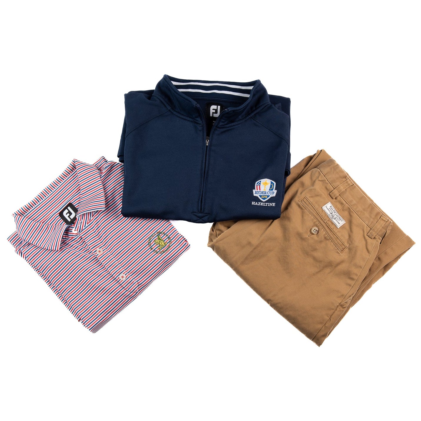 Folded navy jacket, striped shirt, and brown pants on a white background