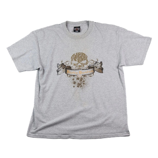 Gray t-shirt with a skull design and text on a white background
