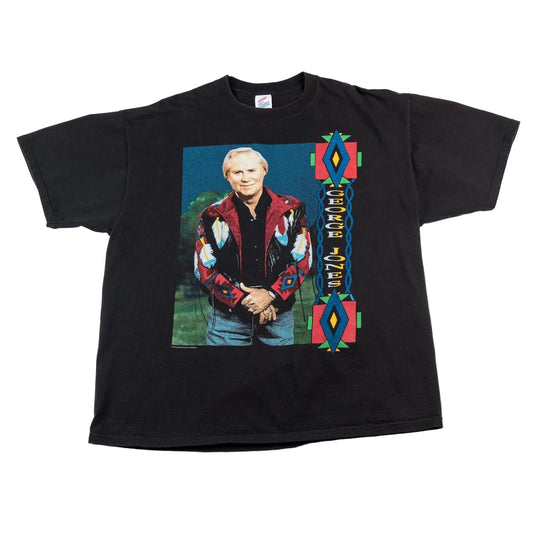 Black t-shirt with a graphic of a person in a patterned jacket on a white background