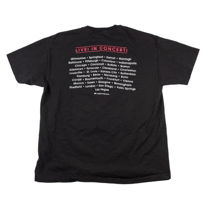 Black t-shirt with concert tour information on a white background