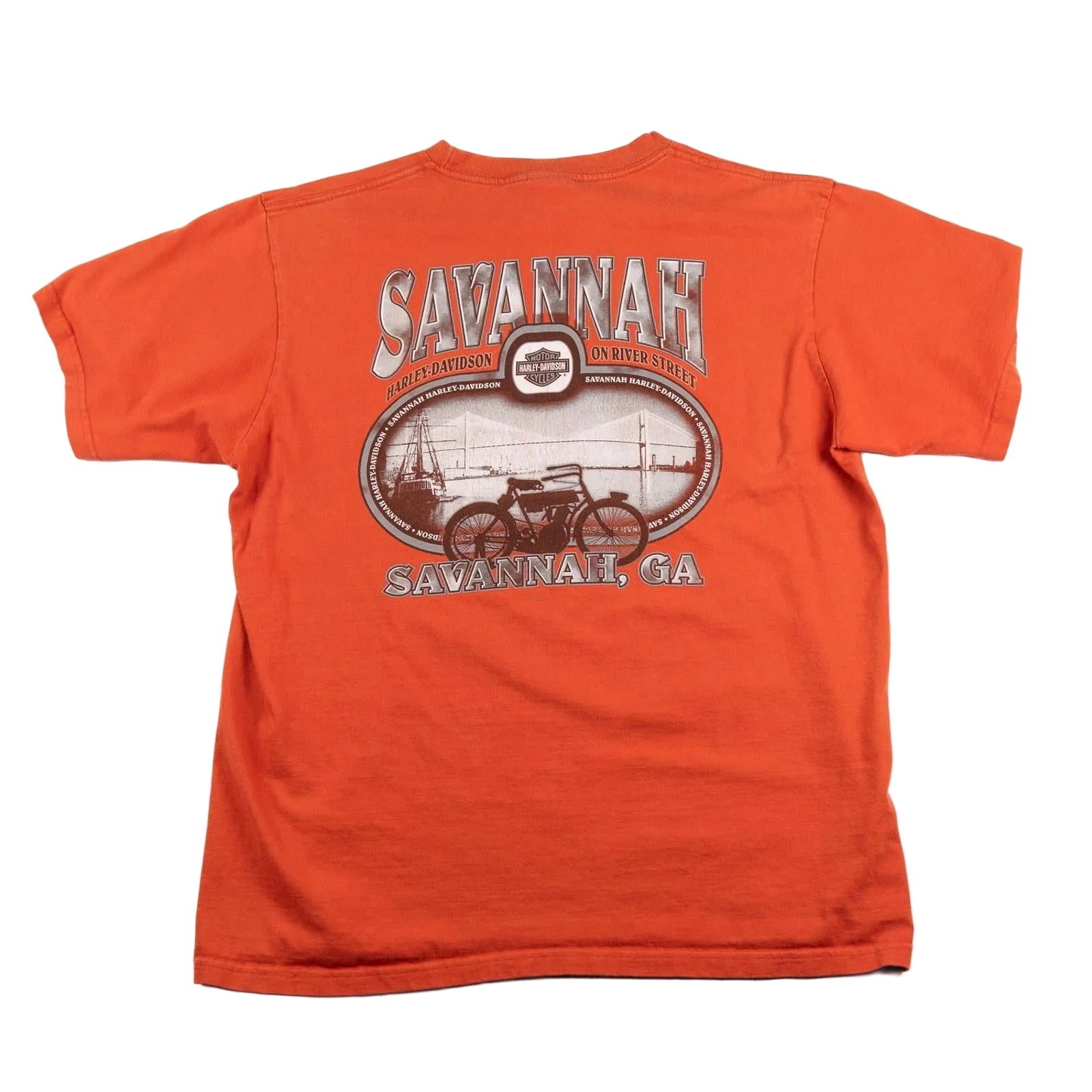 Orange t-shirt with 'Savannah' graphic design on a white background