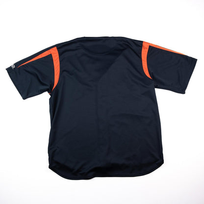Black sports jersey with orange accents on a white background