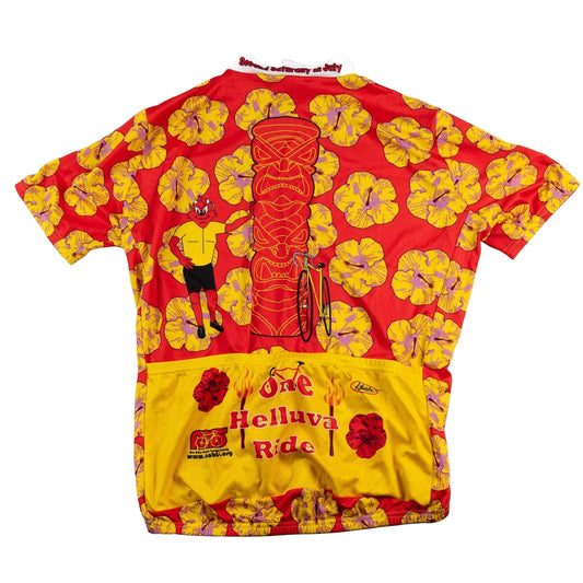 Colorful cycling jersey with tiki design and text on a white background