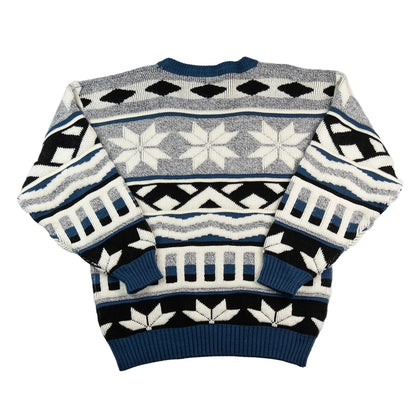 Patterned sweater with geometric design on a white background