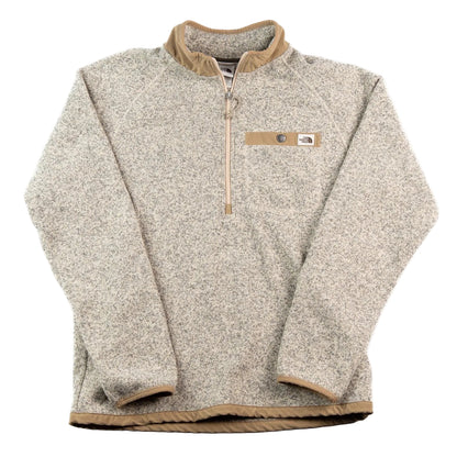 Beige fleece pullover with brown trim on a white background