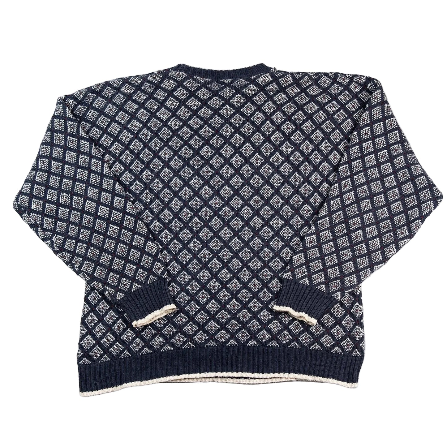 Navy blue and white patterned sweater on a white background