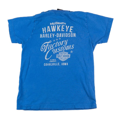 Blue t-shirt with white text and graphics on a white background